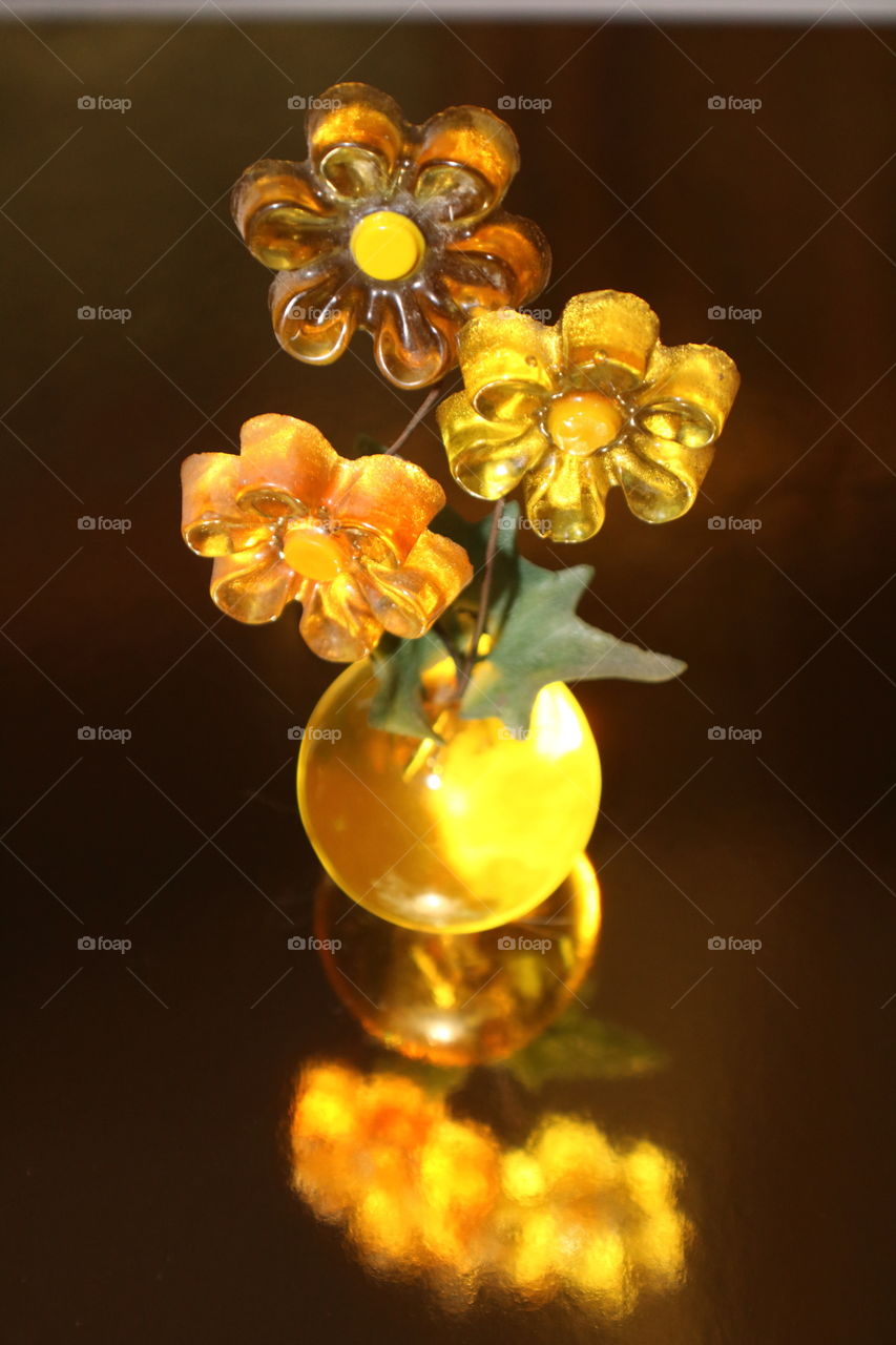 Yellow Floral Vase on Reflective Surface