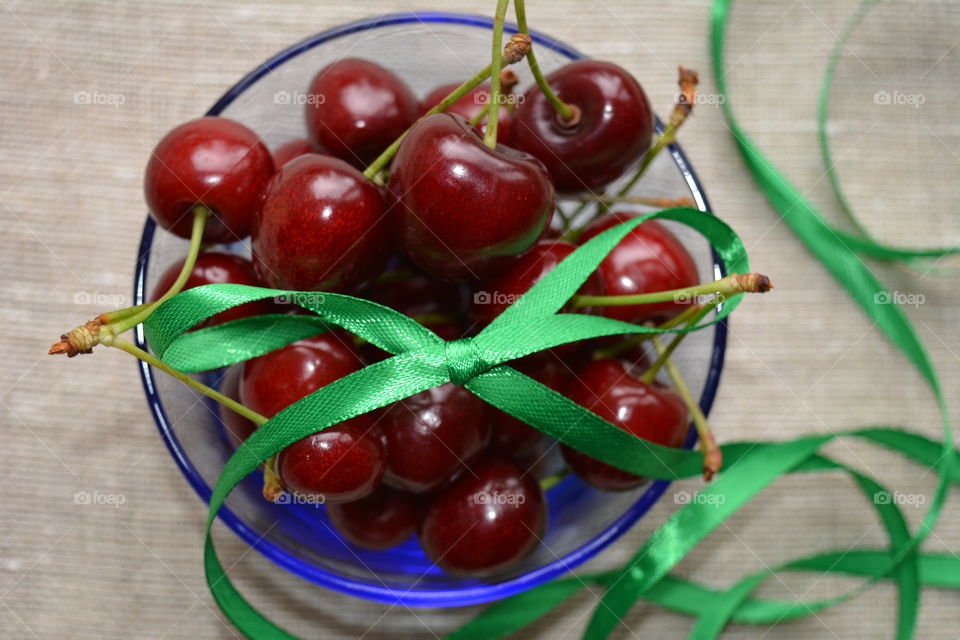 red cherry on a plate tasty healthy summer food top view natural background