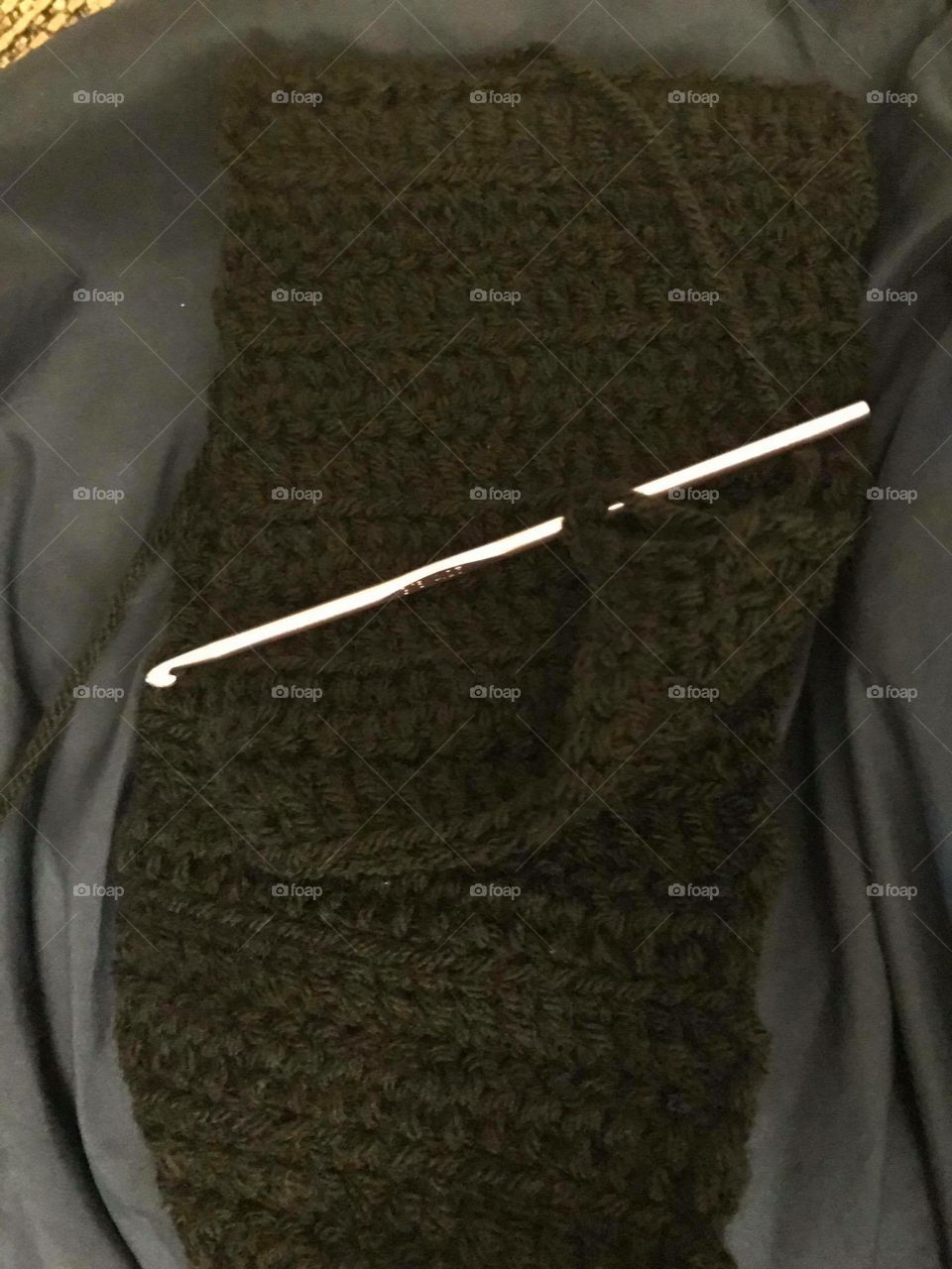 Crocheting a scarf. 
