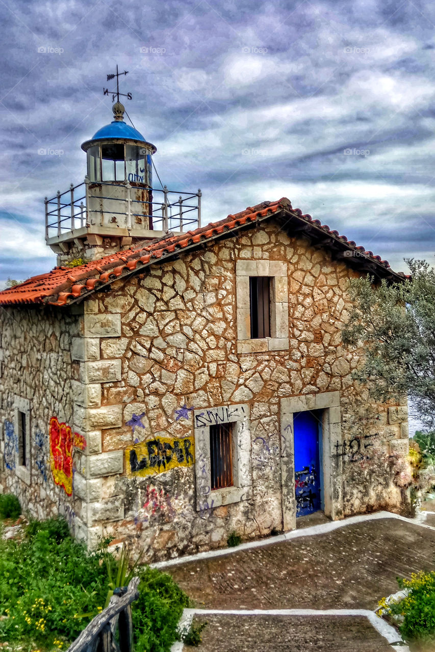 An old lighthouse in the port city of Astros,Greece