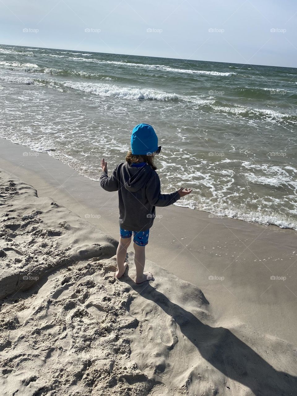 Boy playing on the beach