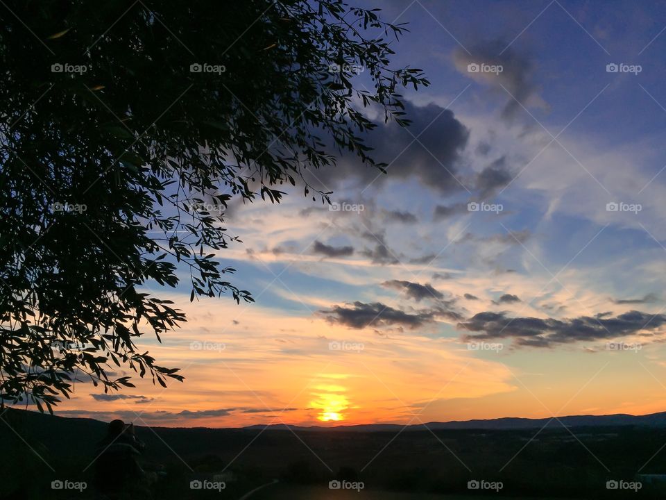 Scenic view of dramatic sky at sunset in Tuscany