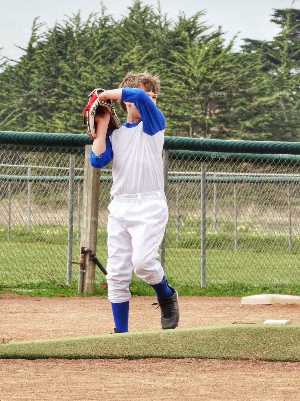 Little Leaguer Throwing A Baseball

