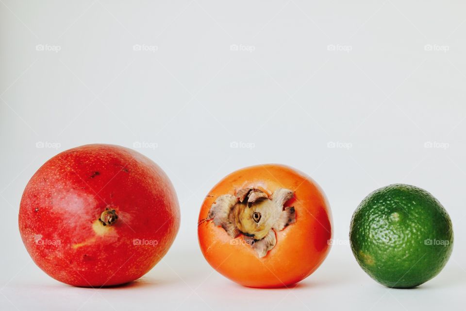 Kaki , mango , lime and a smothie 