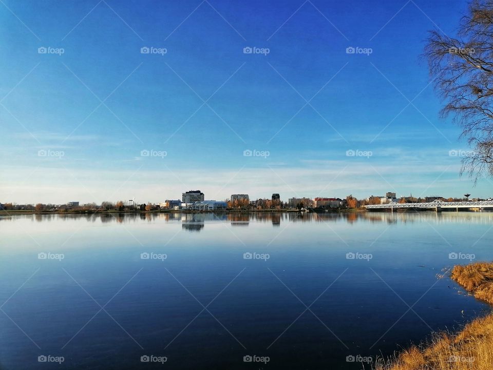 Great view on the Tornio River, Lapland, Finland in autumn. The Finnish-Swedish border is shown on the left.