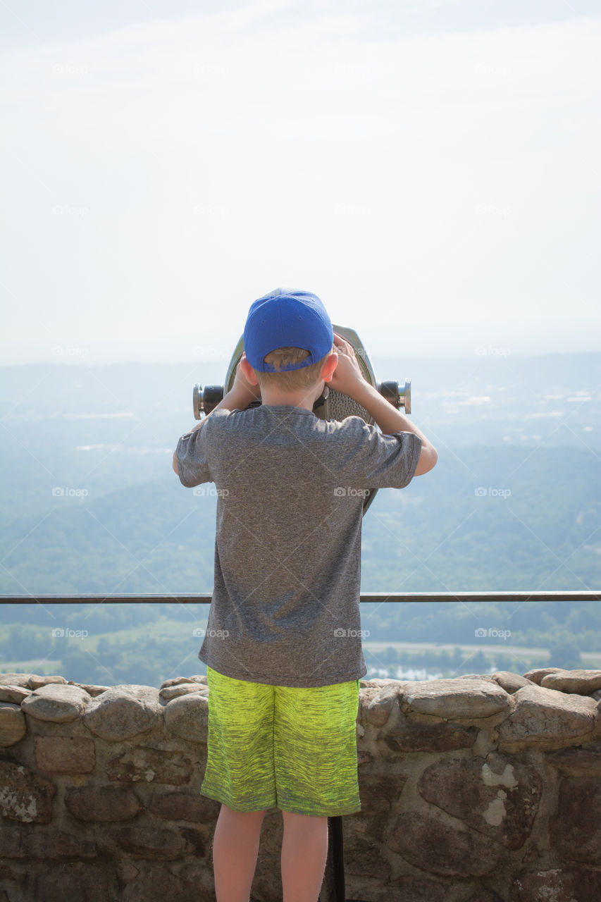 Young Boy Looking Through Binoculars over Lookout Mountain 