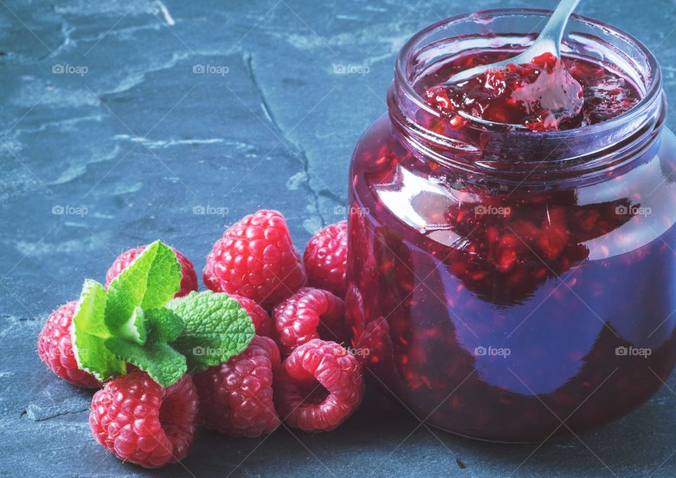 Raspberry jam and raspberries