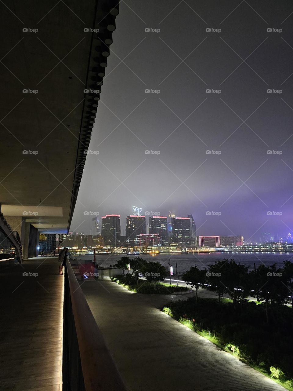 Looking at Harbour City night view from Hong Kong West Kowloon Cultural District