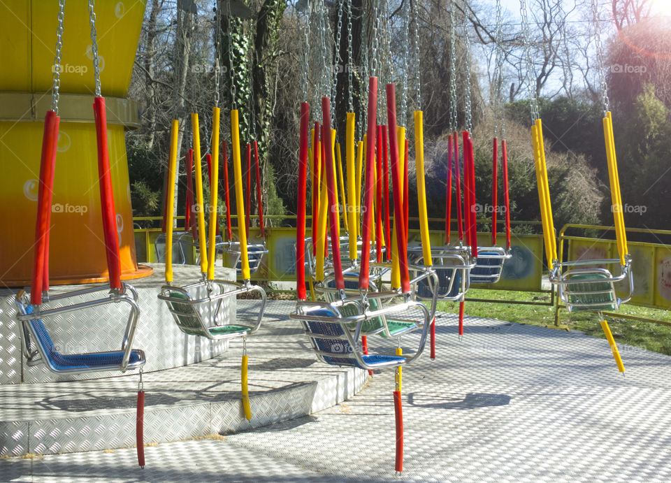 Multicolored carousel. multicolored caroysel in playground park