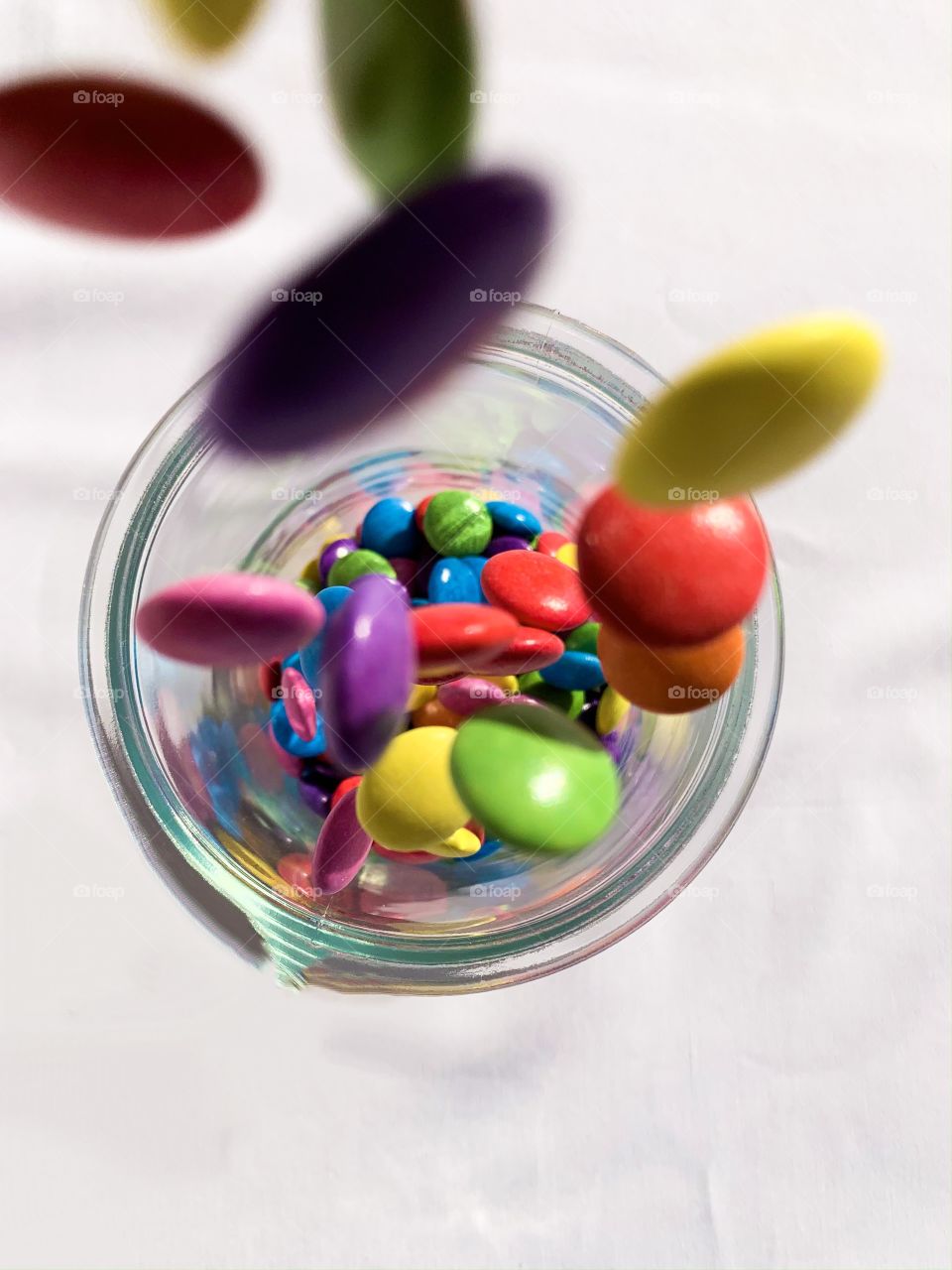 Smarties! What-a-lot-I-got! Ellipsis where you look - falling into a cylindrical jar