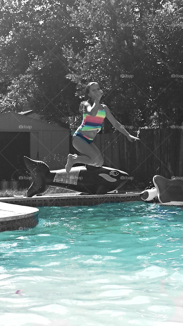 pool. my daughter jumping into the pool