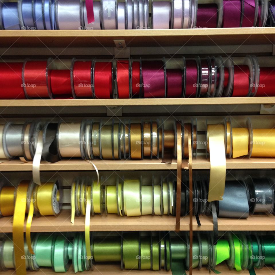Haberdashery shop ribbons and trims rows for market sale 