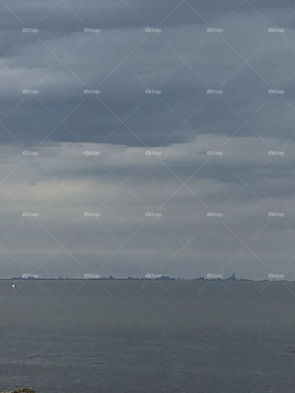 Cloudy gray sky's over choppy waters. Rainy cloudy day on Lake Michigan in a Portage IN