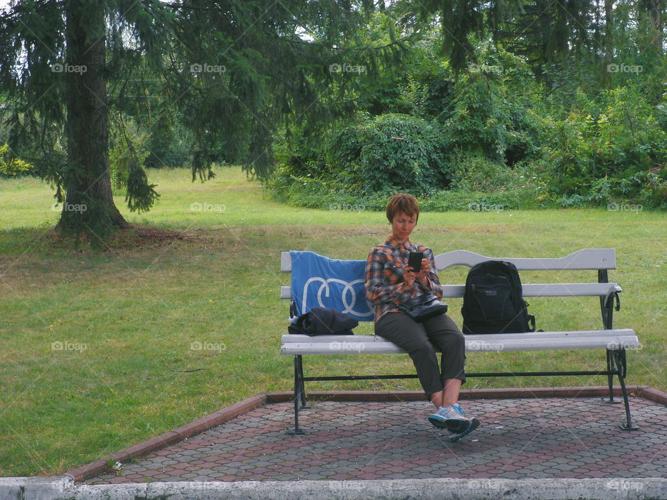 girl sitting on a bench in the park