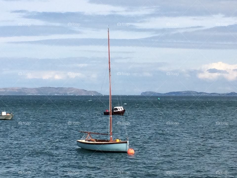Solitude. This lovely little boat caught my eye anchored in Beaumaris, Anglesey in Wales. Just loved it!