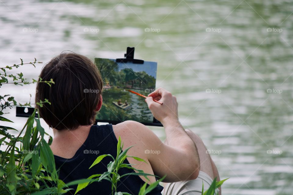 Painting by the water