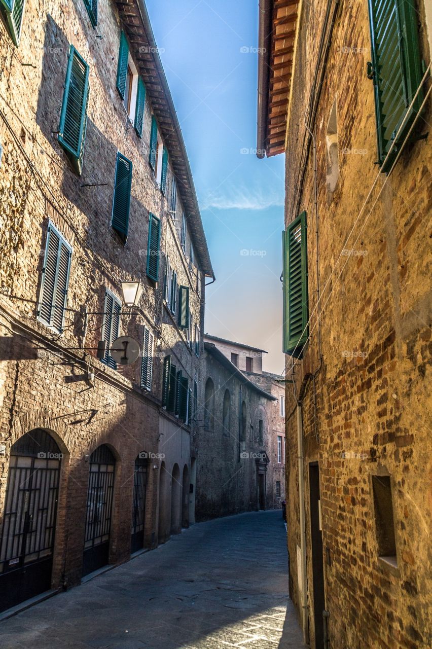 Sienna, Italy . A morning street scene from Siena, a city in the Tuscany region of Italy. 
