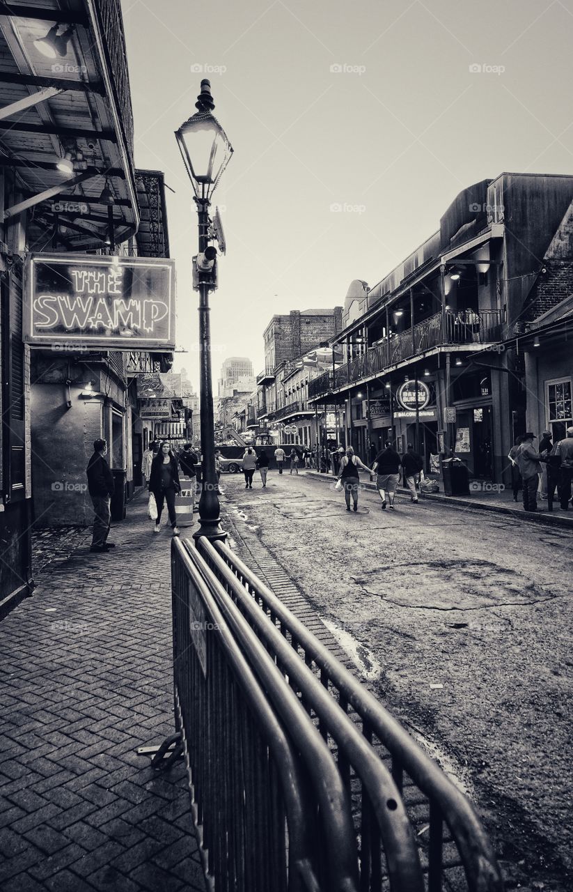 In front of The Swamp pub, at the French Quarter, New Orleans, Louisiana, USA. Monochrome rendition of the street scene.