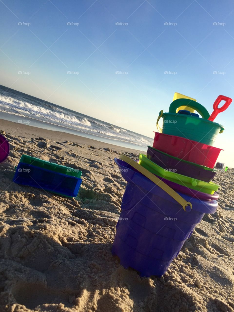 Sandcastle Tools. The pile of buckets after the end of a project. 