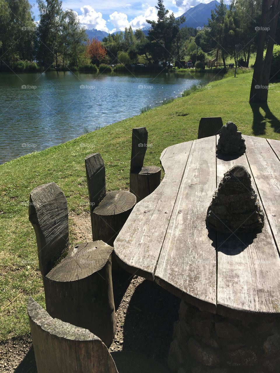Rustic wooden table by the lake