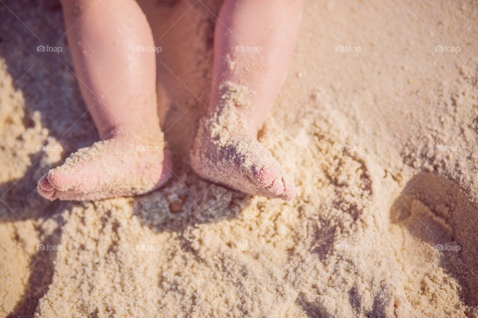 Baby feet in sand