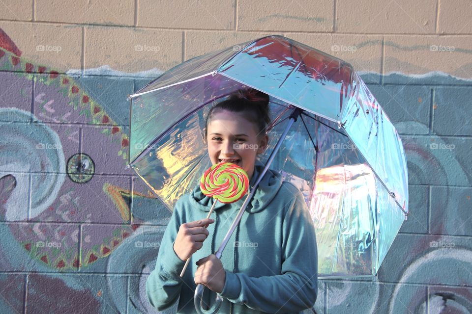 Girl holding Iridescent umbrella