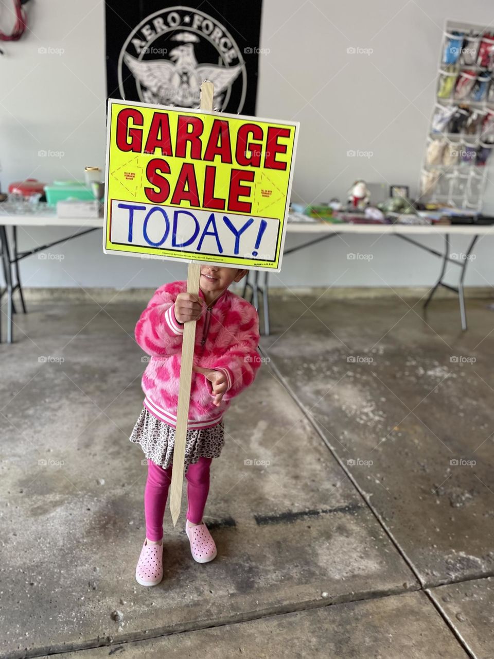 Toddler girl ready for garage sale, toddler holding garage sale sign, come to the garage sale, advertising for a sale, garage sale signs 