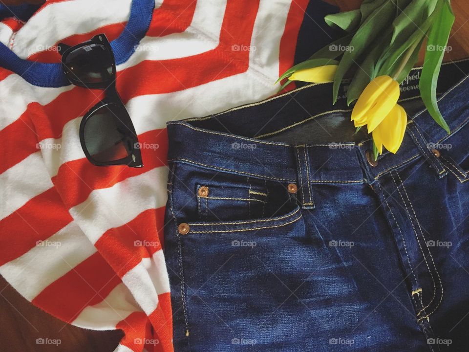 Demin jeans and sunglasses with flower
