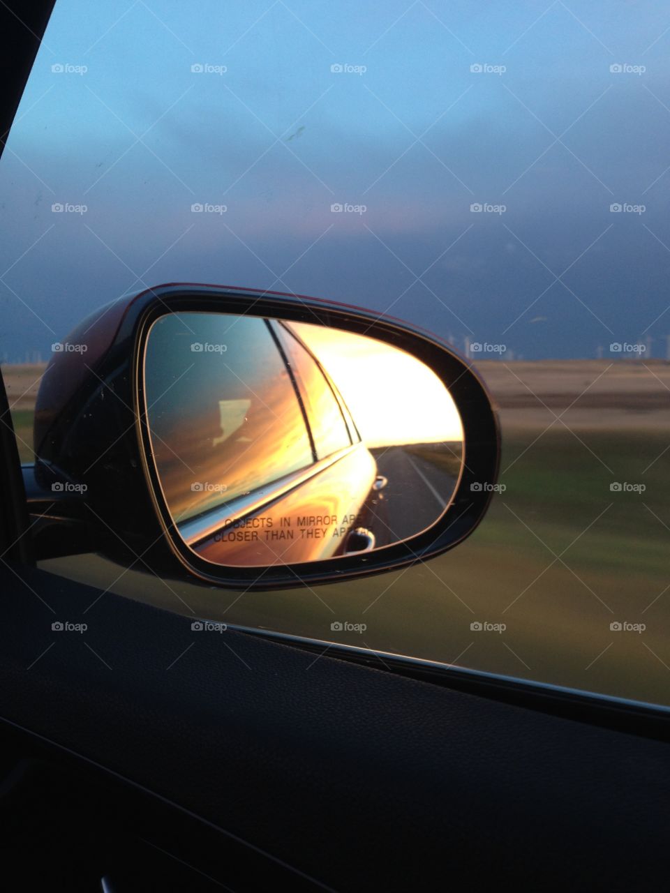 Montana sunset in the rear view mirror