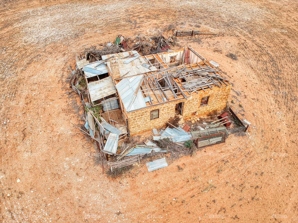 Abandoned ruin of a stone work house with caved in roof