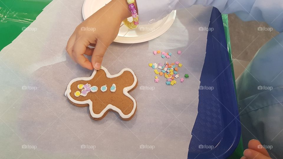 Decorating a gingerbread man