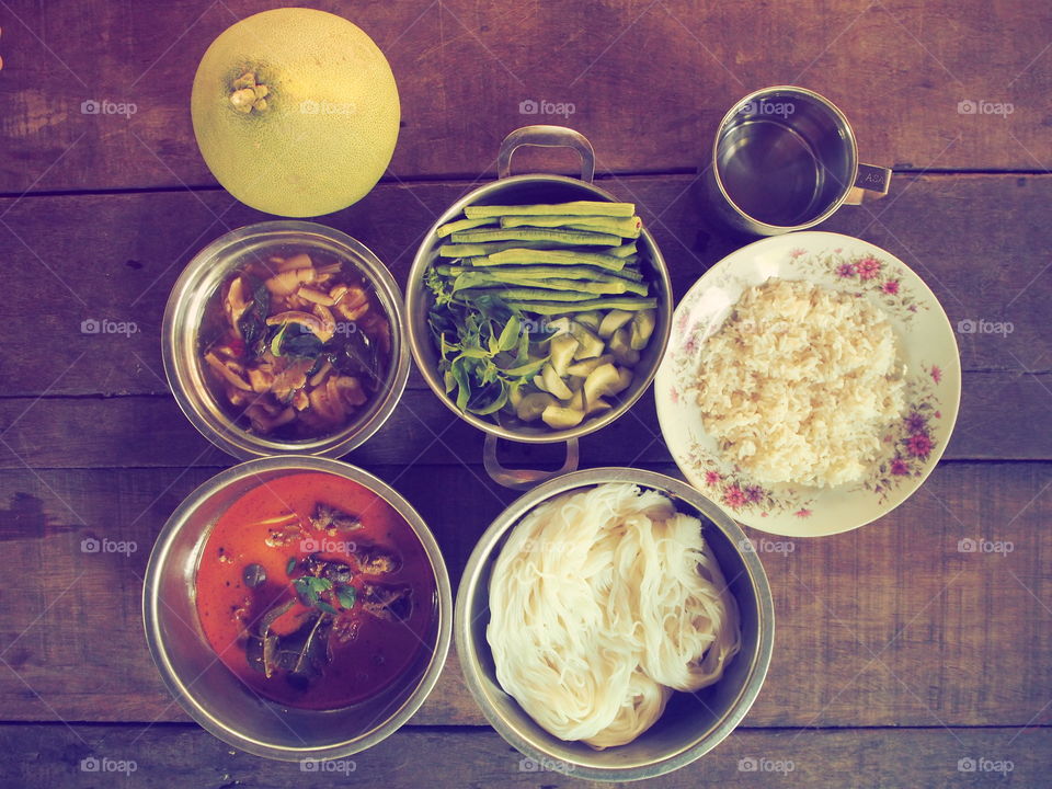 rice and kurry thai food on wood table,vintage food of thailand