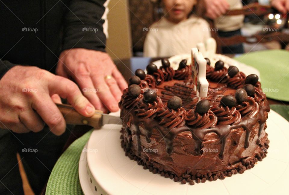 a chocolate birthday cake to share with family