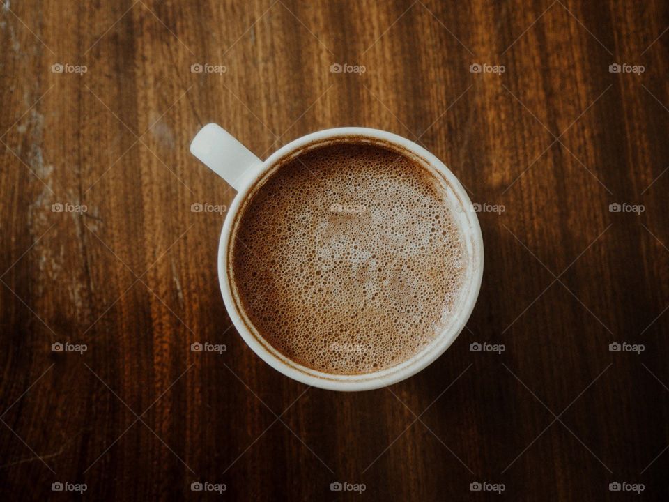 Coffee mug on an old wooden table