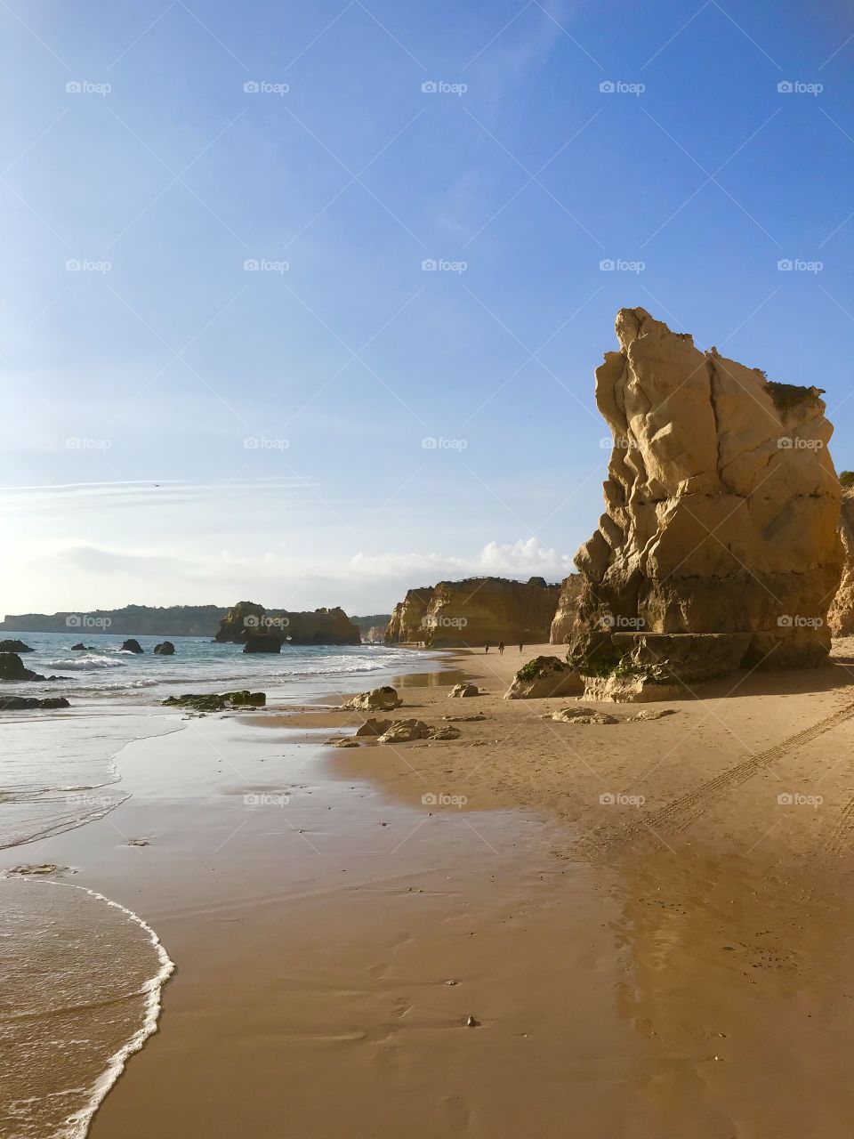A day at the beach. The tide comes in. Stunning rock formations on the beach. The Algarve, Portugal. 