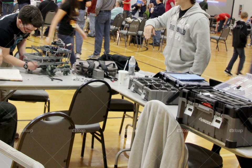 Robotics team equipment parts set up on tables