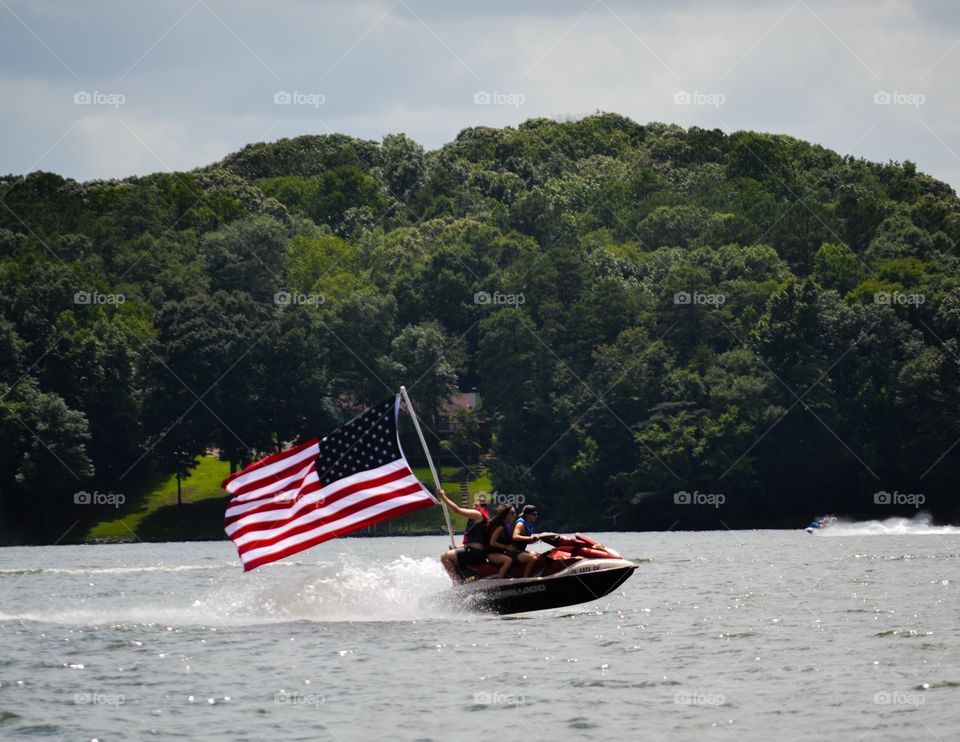American Flag. This wave runner was traveling the lake on Independence Day with the flag. 