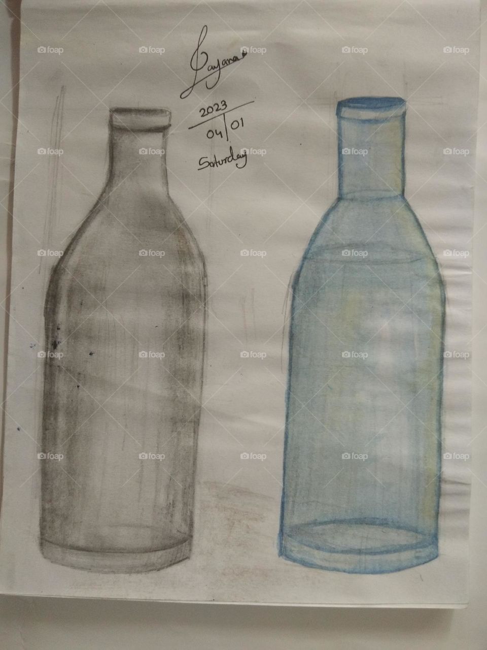 this is scratch drawing of two bottles one is fully scratched and other one is coloured with blue colour. There are art techniques.
There is the modal signature of the artist and the date.