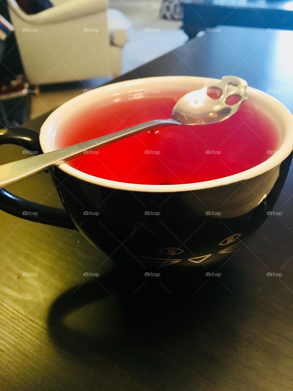 Rose tea red black mug cat skull spoon table