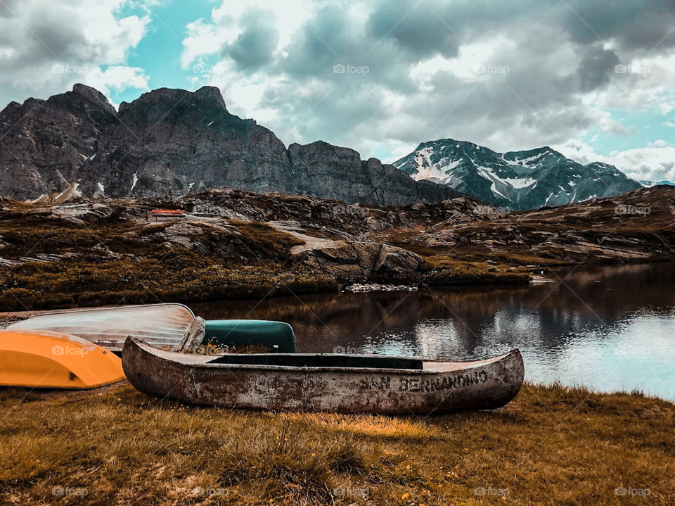 Lake in the mountain . Boats on the lakeshore