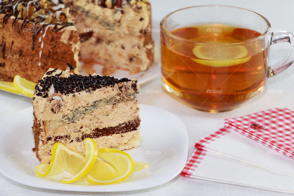 cake and cup of tea with lemon