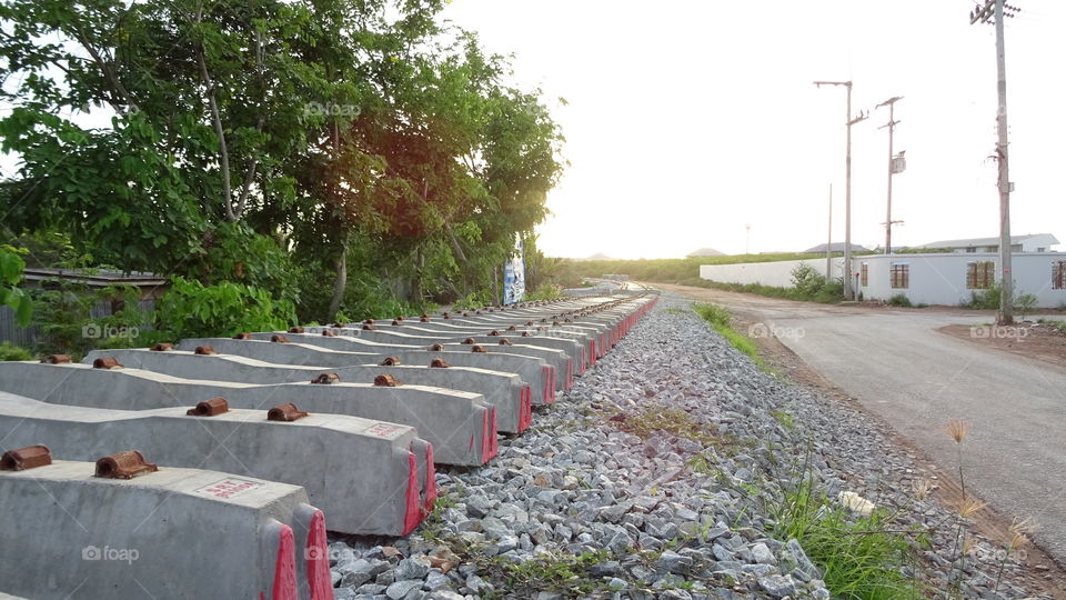 Railway, live rail, sleeper. Rail way , live rail and sunset