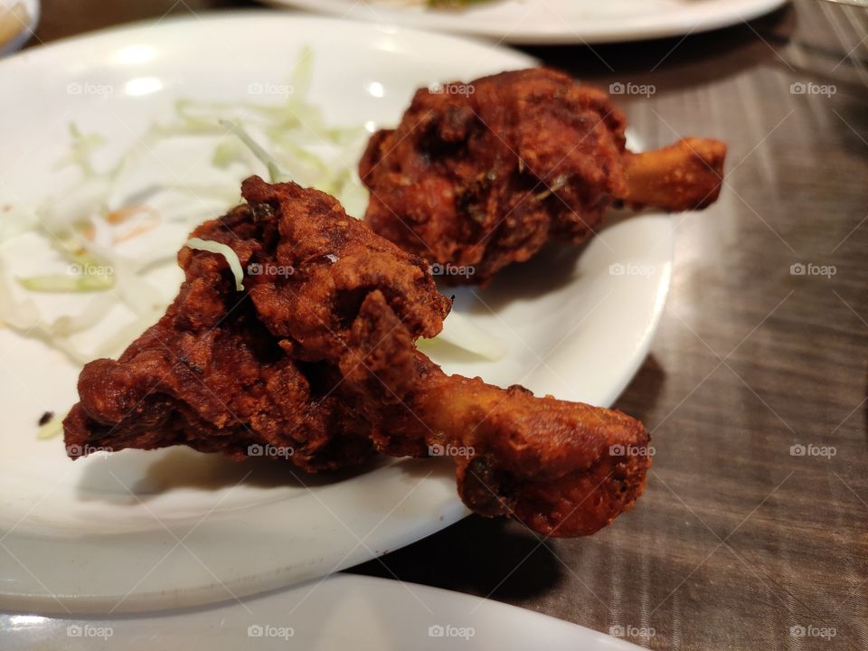 Sizzling spicy fried asian chicken lollypops