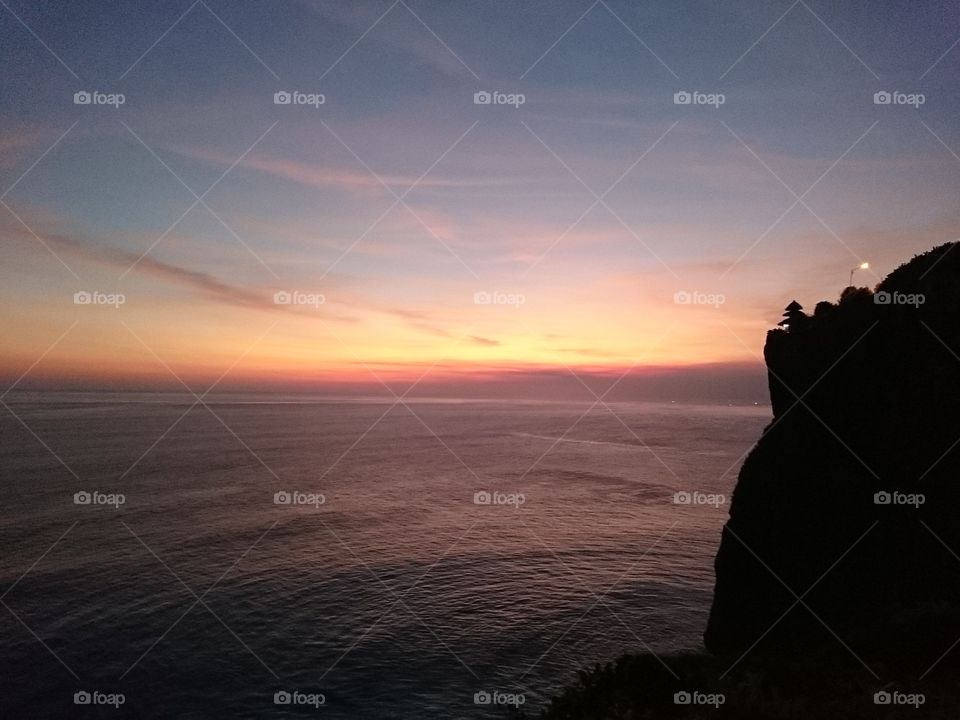Sunset in Bali . cliffside sunset view.