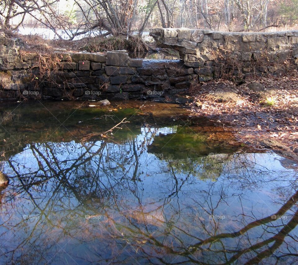 stream with stone wall