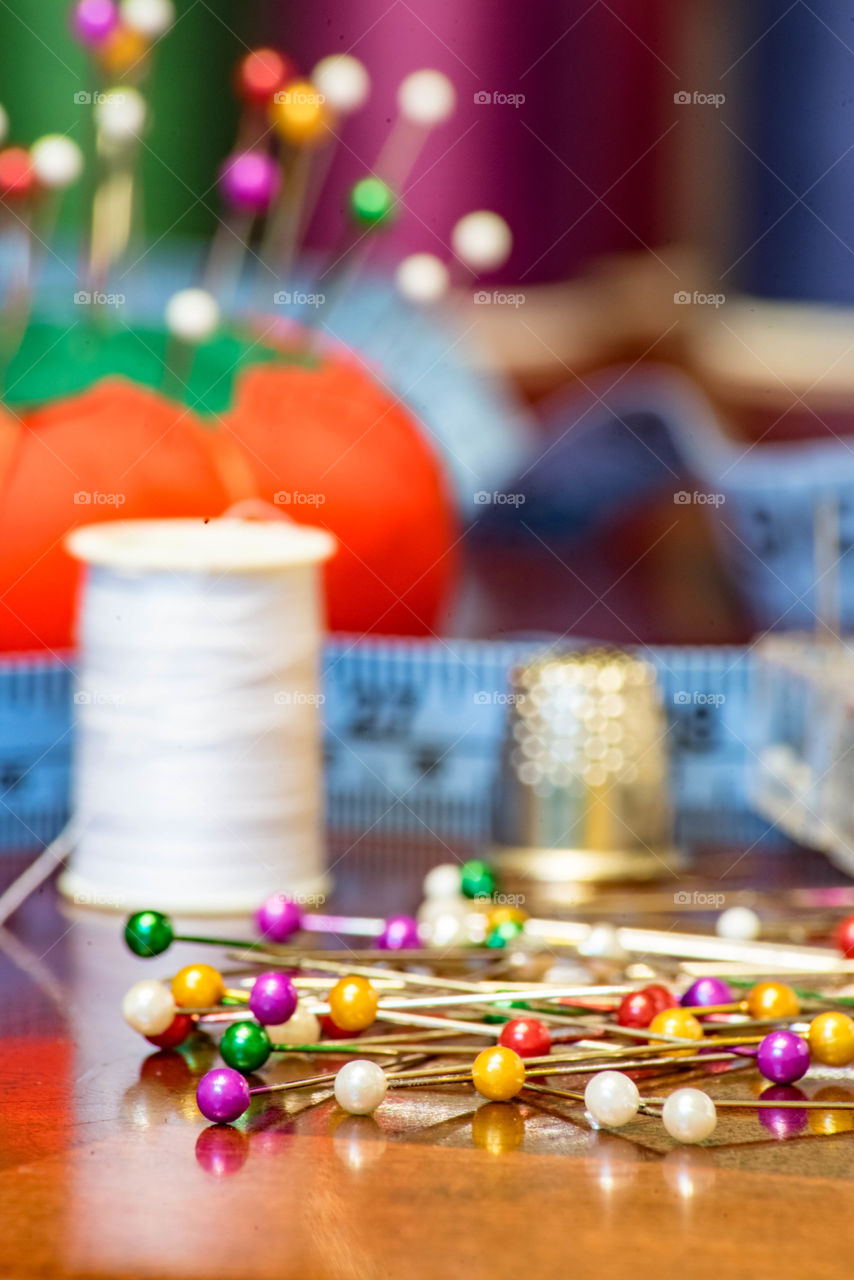 Elevated view of multi colored pin on table