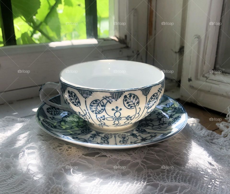 Old china cup and saucer with hand made pattern