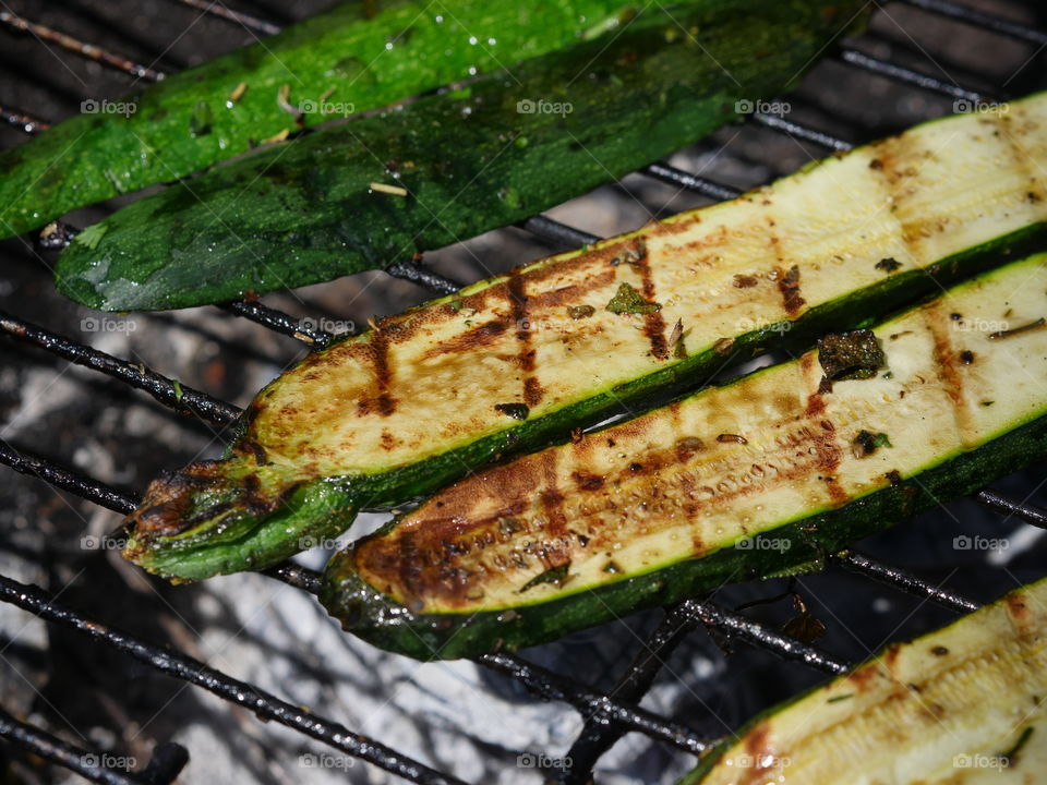 Courgette zucchini on the grill with grillmarks