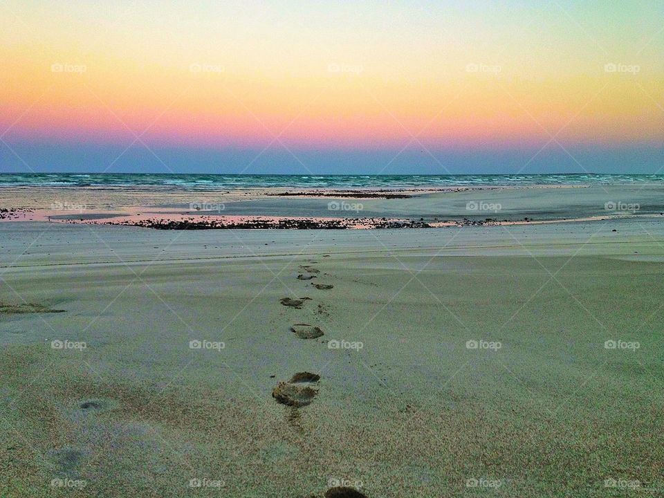 Foot prints on the beach