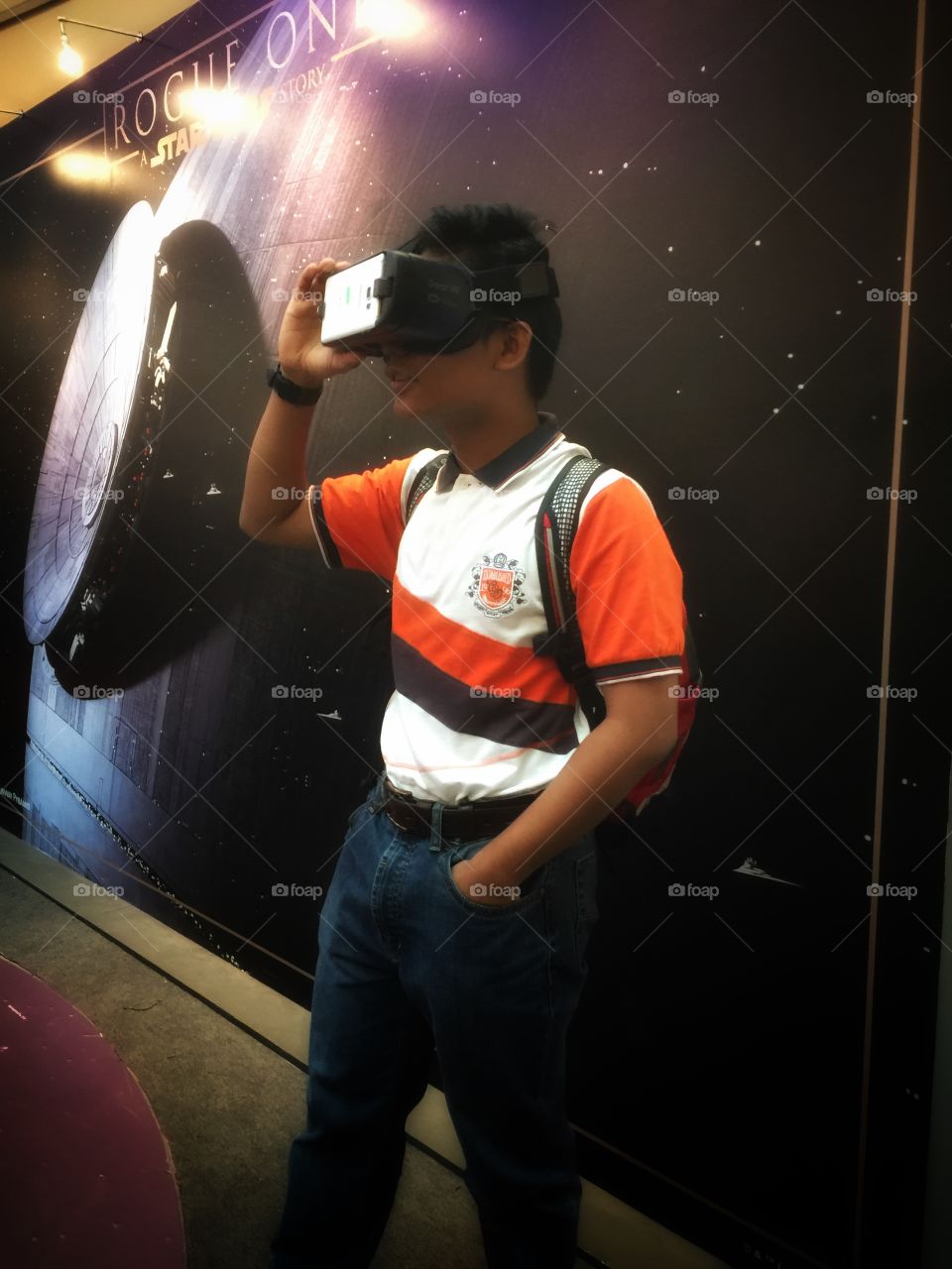Young man using virtual reality headset